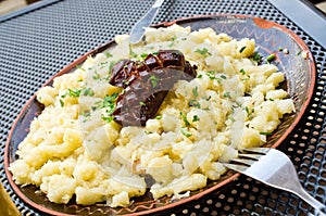 Dumplings with sheep cheese and sausage