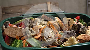 A dumpster with food leftovers. Food waste in foodservice industry. Global food crisis photo