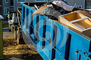 Dumpster, recycle waste and garbage bins near new construction site of appartment houses building photo