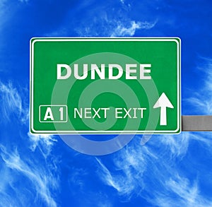 DUNDEE road sign against clear blue sky