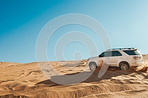 Dune bashing on summer, blur movement of sand