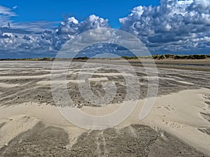 Empty beach landscape by strong sea breeze and Cumulus clouds