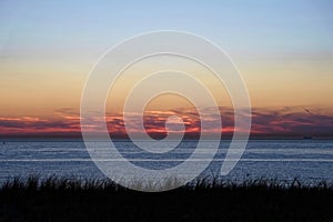 Dune and North sea landscape by dusk