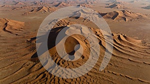 Dune _Sky Flying over curve shaped sand dunes during hot summer weather