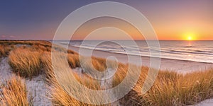 Dunes and beach at sunset on Texel island, The Netherlands photo