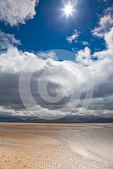 Dunes beach white clouds blue sky background