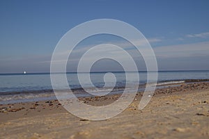 calm Baltic Sea after the storm - thrown stones and sea of amber