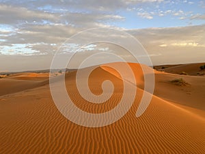 Dunes in the Sahara desert, Merzouga desert, setting sun. Morocco
