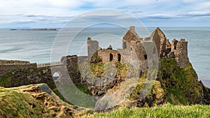 Dunluce Castle, the famous fortress in ruin in Northern Ireland UK, seen at sunrise