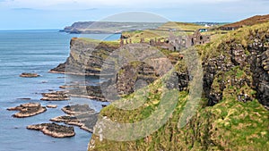 Dunluce Castle, the famous fortress in ruin in Northern Ireland UK, seen at sunrise