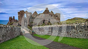 Dunluce Castle, the famous fortress in ruin in Northern Ireland UK, seen at sunrise