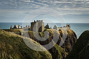 Dunnottar Castle on top of a hill by the sea on a cloudy day, Stonehaven, Scotland, United Kingdom