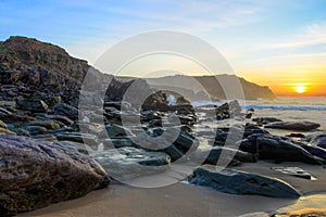 Dunquin bay beach at sunset in Ireland.