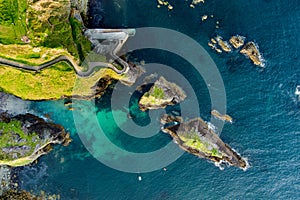 Dunquin or Dun Chaoin pier, Ireland\'s Sheep Highway. Aerial view of narrow pathway winding down to the pier