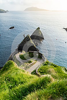 Dunquin or Dun Chaoin pier, Ireland\'s Sheep Highway. Narrow pathway winding down to the pier,