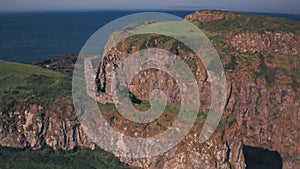 Dunseverick Castle ruins on the Antrim Coast, Northern Ireland. Aerial drone vie