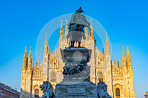 Duomo cathedral in Milano viewed behind statue of king Vittorio Emanuele II