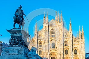 Duomo cathedral in Milano viewed behind statue of king Vittorio Emanuele II