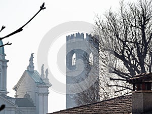 Duomo Nuovo and Broletto tower in Brescia in haze