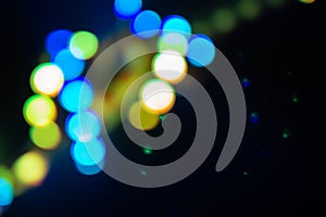 Duotone green and blue spiral of blurry neon lights. Abstract background of 80s colors