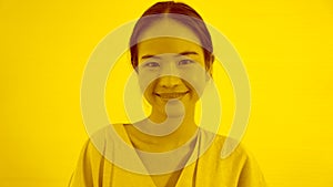 Duotone or half tone portrait of young Asian woman in studio