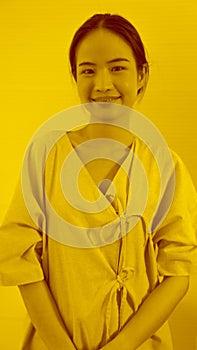 Duotone or half tone portrait of young Asian woman in studio