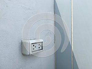 Duplex socket 3P 3 module with water proof cover box attached to the wall outside the building