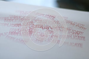 DUPLICATE red rubber stamp