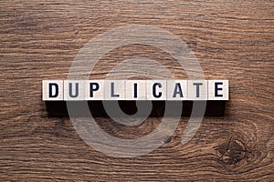 Duplicate - word concept on building blocks, text photo