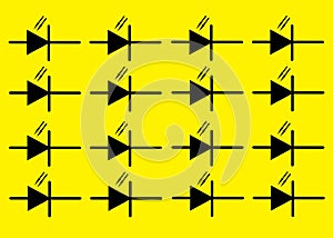 Duplicates of an electrical electronic symbol sign of a Photodiode bright yellow backdrop photo