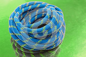 durable colored rope for climbing equipment. knot of braided cable. item for tourism and travel