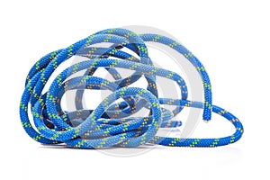 durable colored rope for climbing equipment on a white background. climbing rope. coil of braided cable. item for tourism and