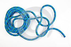 durable colored rope for climbing equipment on a white background. knot of braided cable. item for tourism and travel