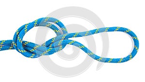 durable colored rope for climbing equipment on a white background. knot of braided cable. item for tourism and travel