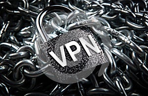 Durable padlock with inscription VPN on a pile of steel chain Internet security