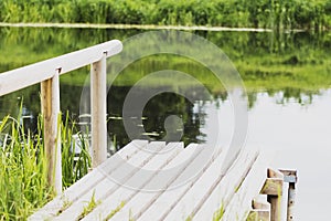 , durable wooden dock on the river for fishing