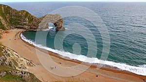 Durdle door and the big waves, filmed from above, Dorset, England