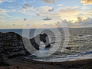 Durdle door in the evening from top cliff