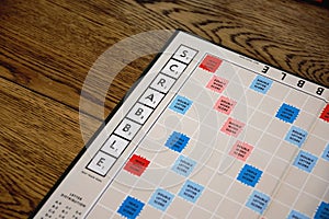 Scrabble board game. Spelling word play, making words out of tiles on square board