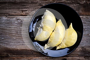 Durian on Black plate. Top view. Tropical fruit. King of fruit.