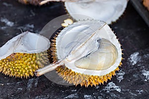 Durian fruit cut in half, a smelly fruit, a specific fruit from Asia