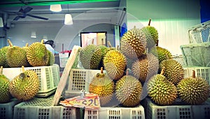 Durian fruits piled on crates
