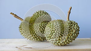 Durian placed on a wooden table in the morning