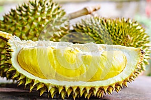 Durian riped and fresh ,durian peel with yellow colour on wooden