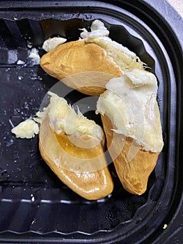 Durian seeds are left right after eating. Small flat seeds of Musang King durian