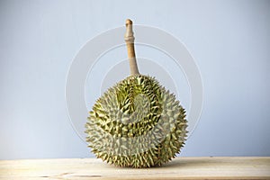 Durian served on a wooden table