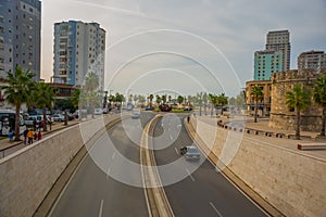 DURRES, ALBANIA: View of the highway and the ancient Venetian Tower in the historical center of Durres.