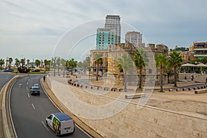 DURRES, ALBANIA: View of the highway and the ancient Venetian Tower in the historical center of Durres.