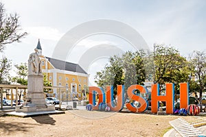 Dushi by Statue and Church photo