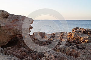 Dusk on a beach in Ibiza, in the Balearic Islands, with the sea in the background